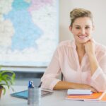 Teacher sitting in classroom